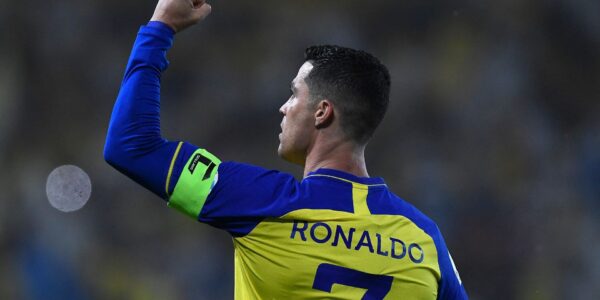 Cristiano Ronaldo disappointed after Al-Nassr’s shocking exit from the tournament, standing on the field with a tense expression.