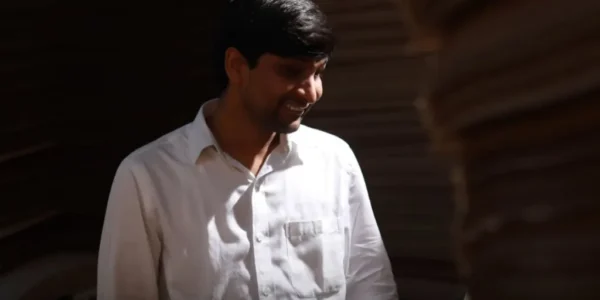 "Srikanth Bolla, India's first visually impaired CEO, delivering an inspiring speech about his journey from adversity to success."