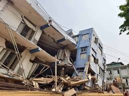 Collapsed buildings and rescue workers searching for survivors after the Myanmar-Thailand Earthquakes, highlighting the widespread destruction and ongoing relief efforts.