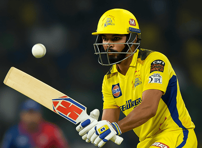 Ruturaj Gaikwad focuses during CSK vs DC IPL 2025 match, wearing CSK yellow jersey and preparing to bat.