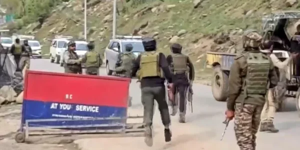 Kashmir attack scene showing emergency responders and damaged tourist vehicles.